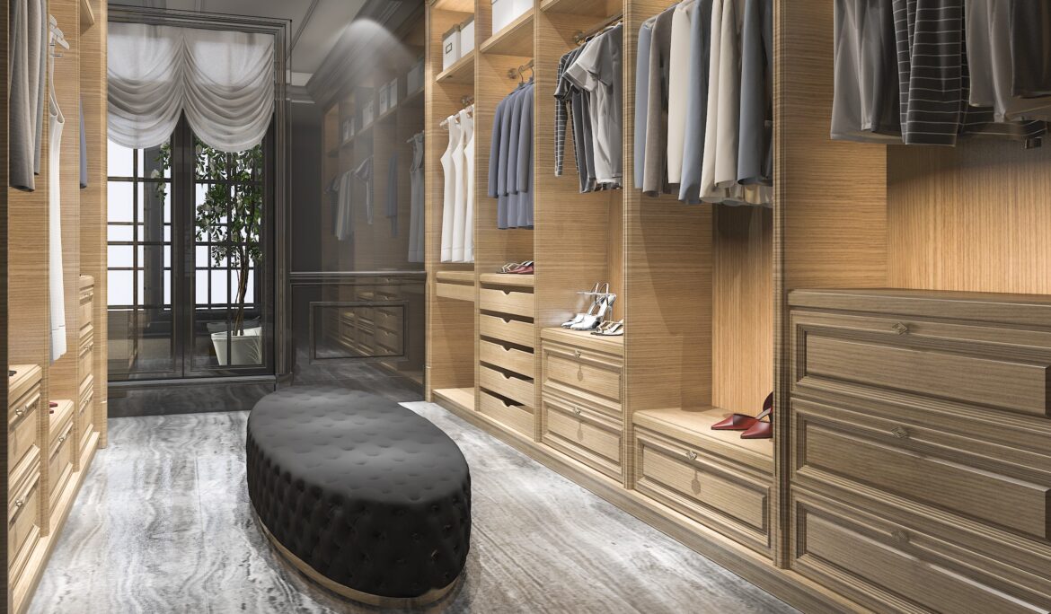 Dubai modern Scandinavian walk closet | Long narrow Dubai modern Scandinavian walk closet with continuous light oak built-in wardrobes