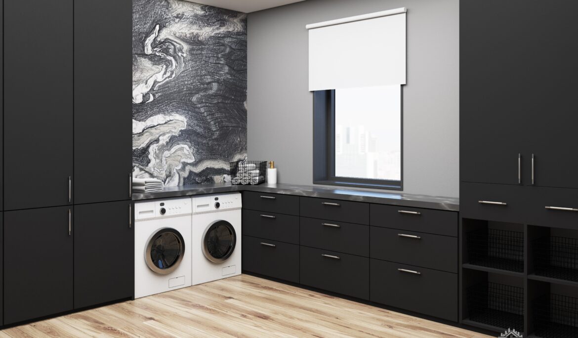 Dubai modern black laundry with matte black cabinets and marble-look slab — DubaiRenovate