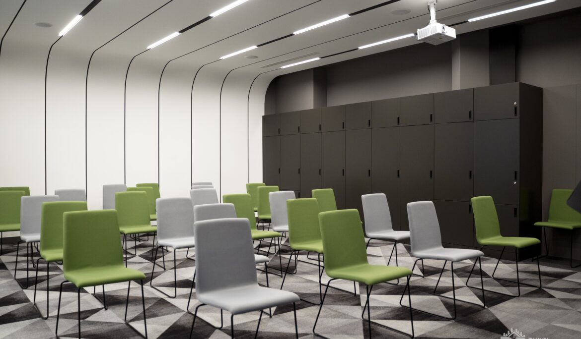 Dubai modern conference room with alternating green and light grey chairs